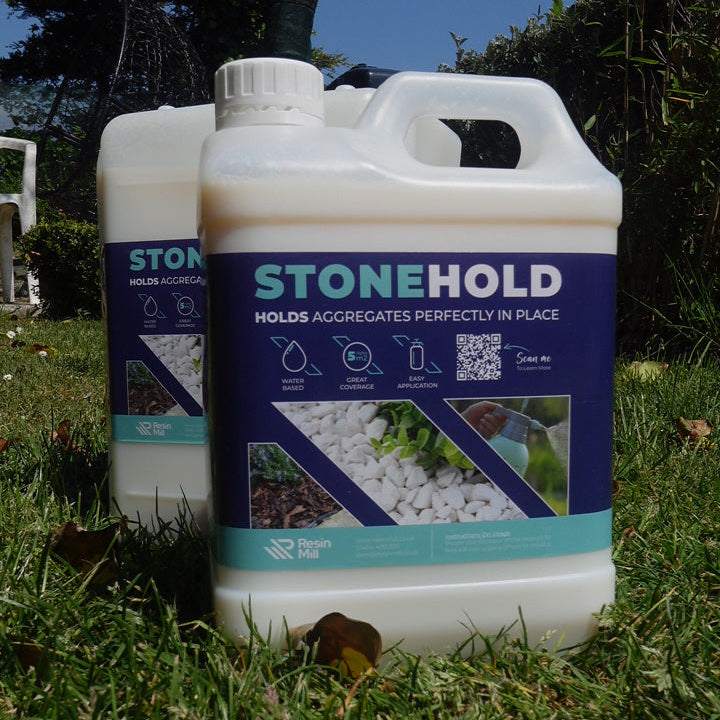Container labeled 'Stonehold' on grass with a blue sky background