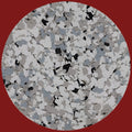 A close-up view of a sample texture of PVA Flakes featuring a blend of gray, black, and white colors.